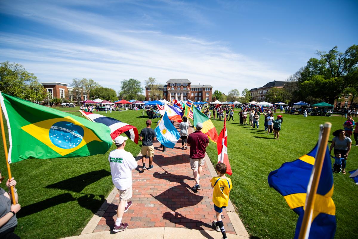 Parade of flags on the Drill Field during the 2023 International Fiesta